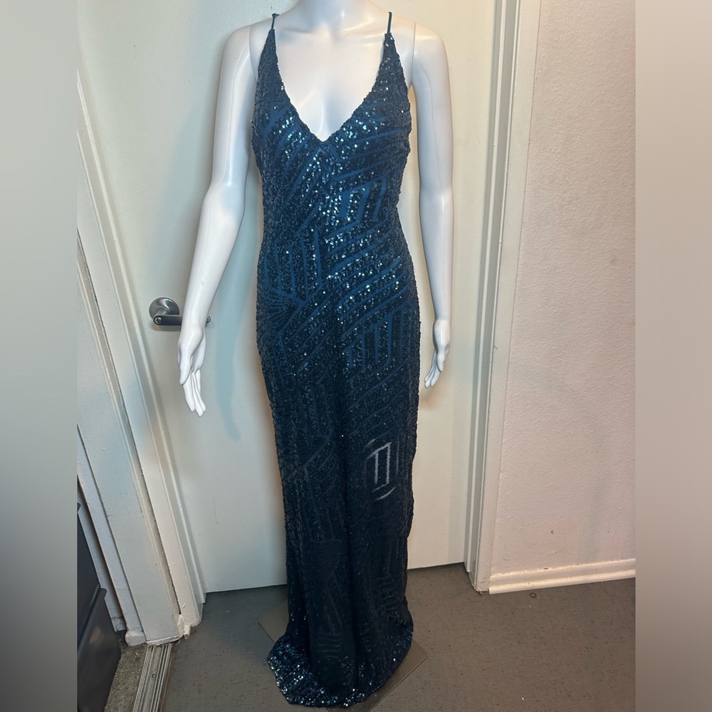 Blue sequin gown with open back and v cut